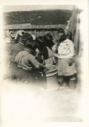 Image of Eskimo [Inuit] children tasting molasses